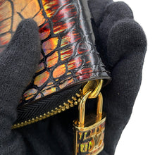 将图像加载到图库查看器中,LOUIS VUITTON Zippy wallet Black/Gold Exotic Leather