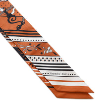 Load image into Gallery viewer, HERMES Twilly Amazon Festival ・Bandana FESTIVAL DES AMAZONES Caramel/White/Black Silk100%

