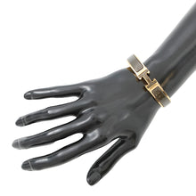 Load image into Gallery viewer, HERMES Clic crack Size PM Noir・Dore Metal Enamel Glitter
